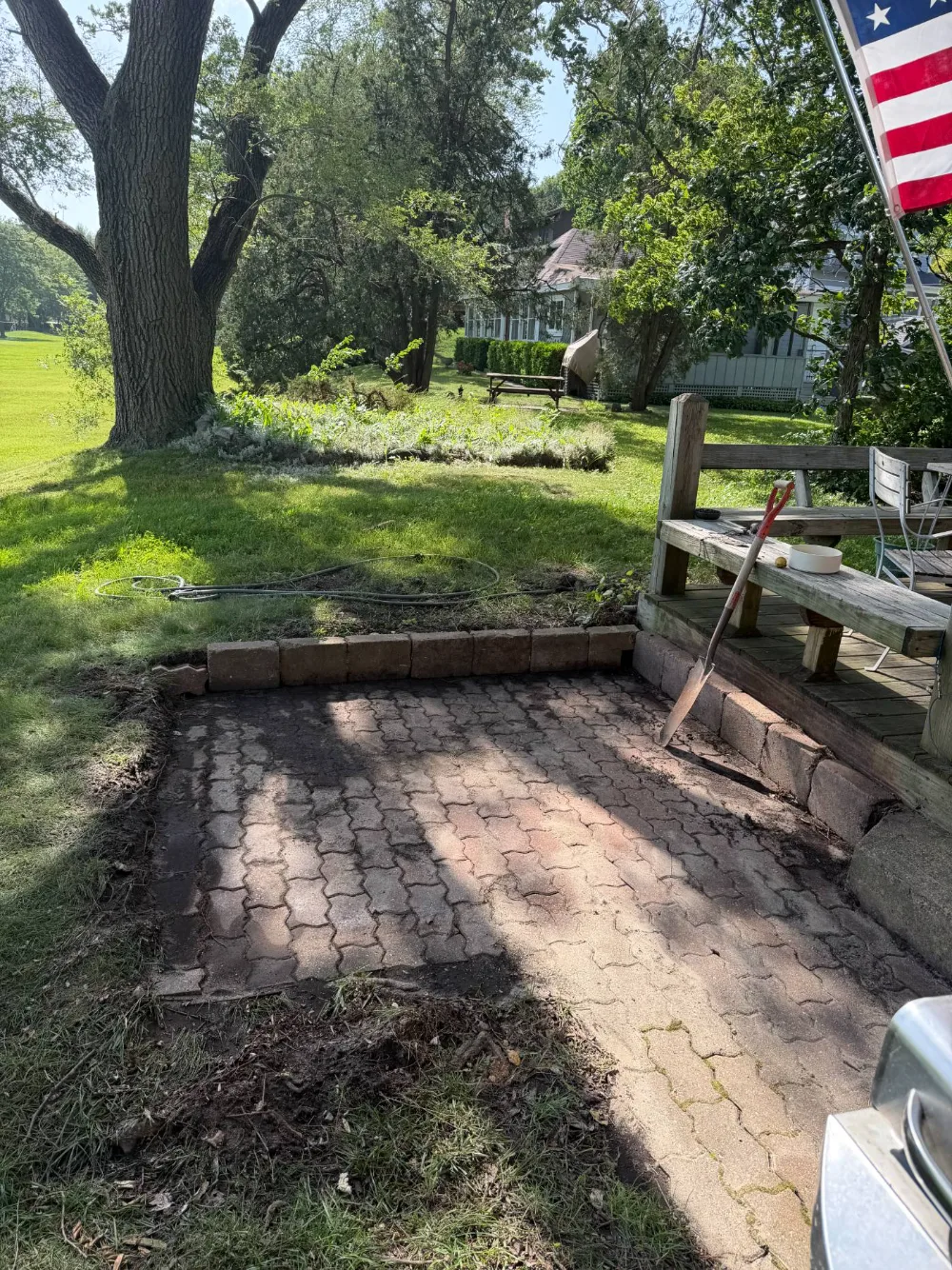 After: the hot tub removed, leaving the paver patio clear next to the deck