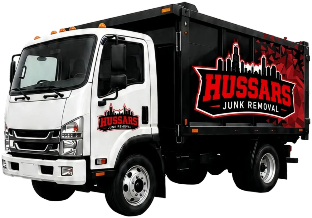 The Hussars truck: white cab, black dump box with the Hussars Junk Removal logo